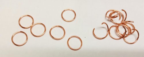 Judy Larson's Make a Soldered Paperclip Chain - , Contemporary Wire Jewelry, Making Chain, Chain Making , Coiling, Coiling Wire, Wire Coiling, Butane Torch, Soldering, Solder, Close half the rings and open the other half.